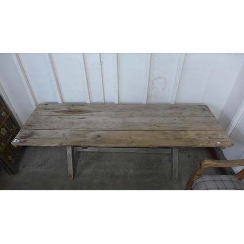 256 - A Gothic pine x-frame farmhouse refectory table