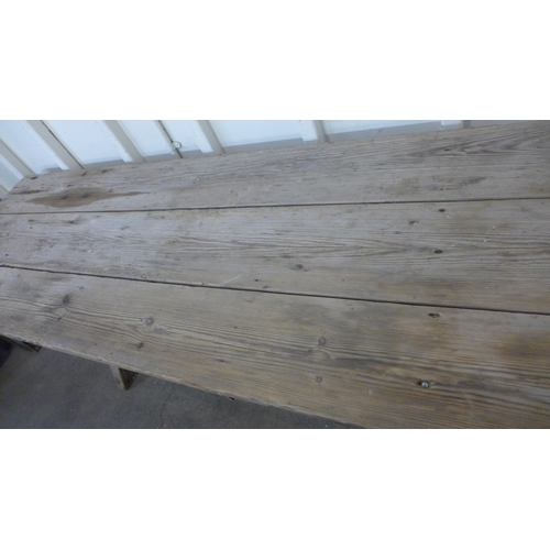 256 - A Gothic pine x-frame farmhouse refectory table