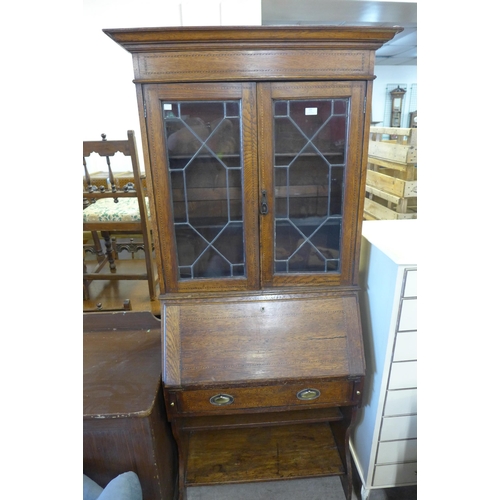 261 - An Edward VII inlaid oak bureau bookcase