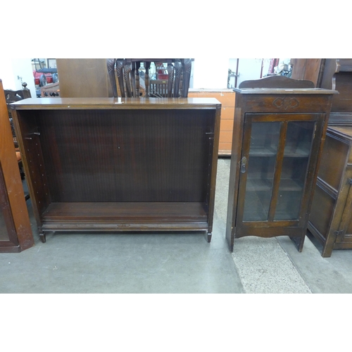 266 - A mahogany open bookcase and a teak corner cabinet