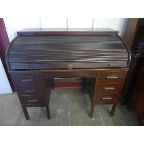 277 - An early 20th Century oak tambour roll top desk