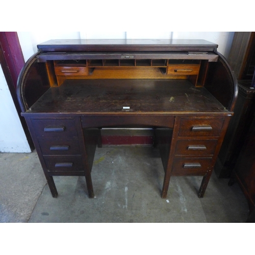 277 - An early 20th Century oak tambour roll top desk