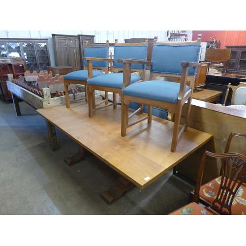 292 - An Arts and Crafts oak refectory table and six chairs, manner of Heals