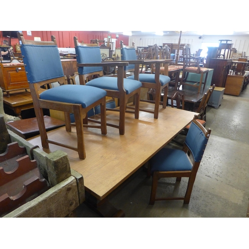 292 - An Arts and Crafts oak refectory table and six chairs, manner of Heals