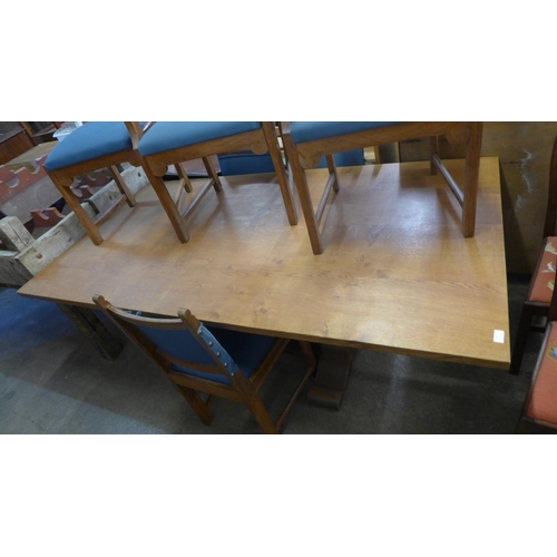 292 - An Arts and Crafts oak refectory table and six chairs, manner of Heals