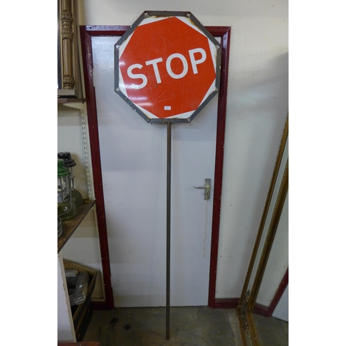 327 - A double sided Stop and Go roadwork sign