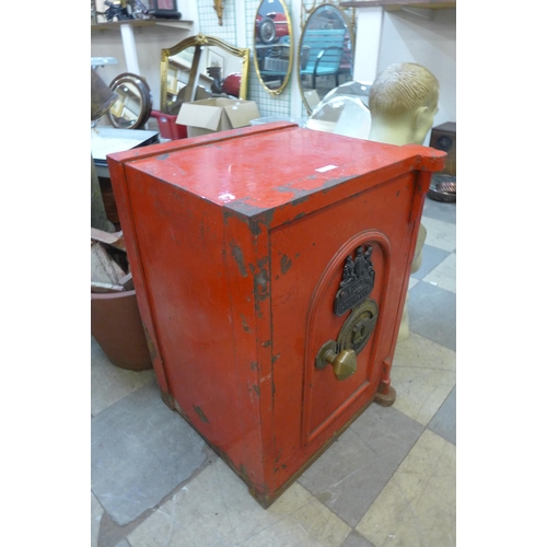 333 - A Victorian painted cast iron safe, with key