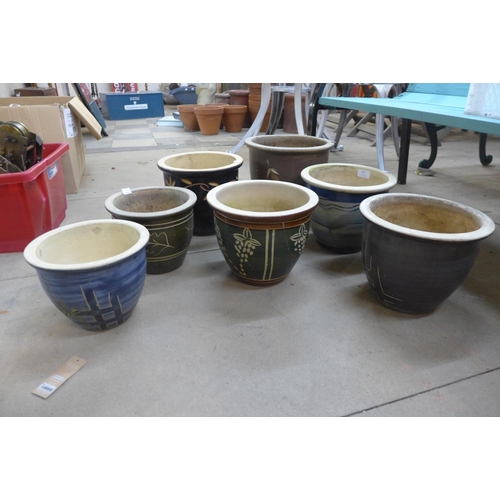 343 - Seven glazed terracotta plant pots