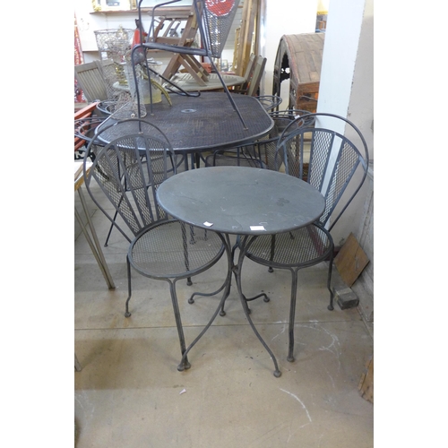 353 - A wrought alloy garden table and two chairs