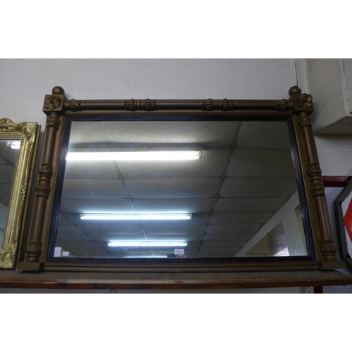 414 - A large ebonised and gilt framed overmantel mirror