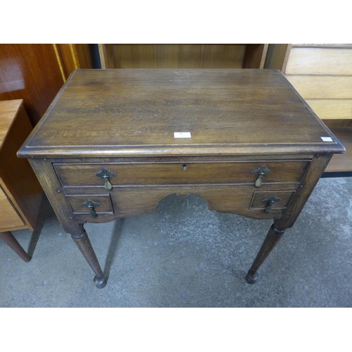 48 - A George II style oak lowboy