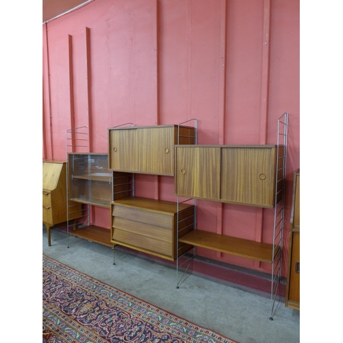 52 - A teak modular room divider