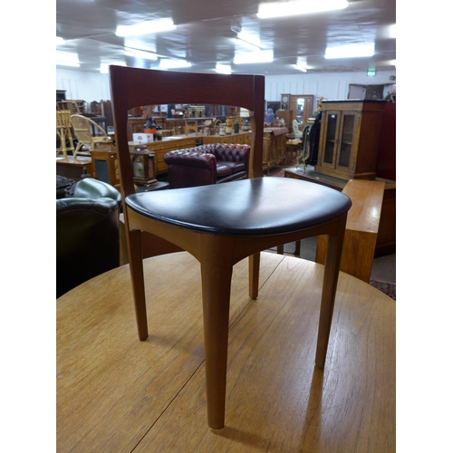 54 - A Nathan teak extending dining table and four chairs