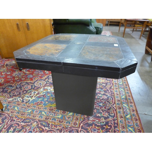 58 - A Brutalist slate topped coffee table, attributed to Paul Kingma