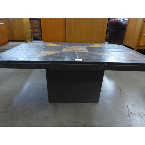 59 - A Brutalist slate topped coffee table, attributed to Paul Kingma