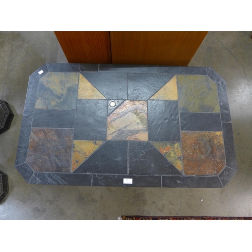 59 - A Brutalist slate topped coffee table, attributed to Paul Kingma