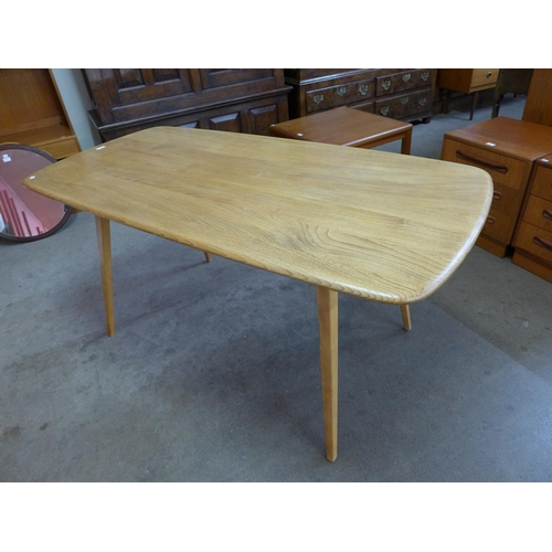 62 - An Ercol Blonde elm and beech plank top dining table