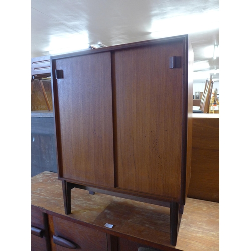 71 - A Beaver & Tapley teak two door cabinet