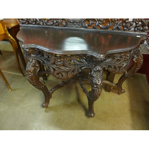 8 - A Burmese style carved hardwood console table