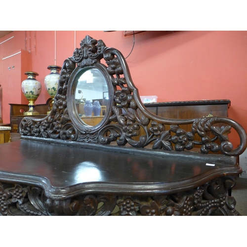 8 - A Burmese style carved hardwood console table