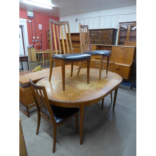 81 - A G-Plan Fresco teak extending dining table and four chairs