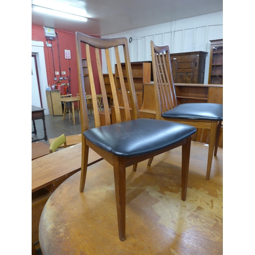 81 - A G-Plan Fresco teak extending dining table and four chairs