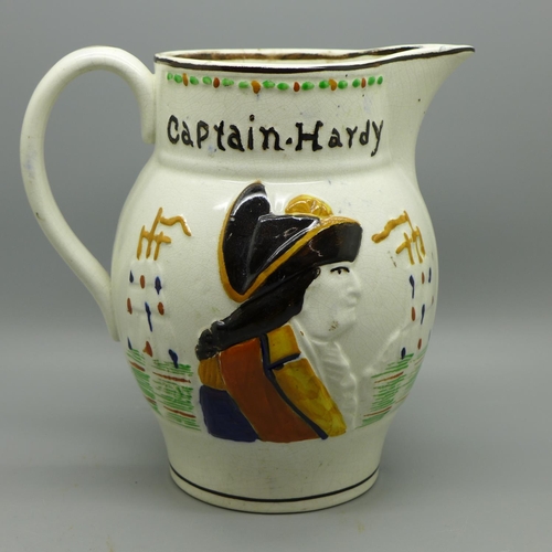 619 - A 19th Century Pratt ware pottery jug, Lord Nelson and Captain Hardy, a/f