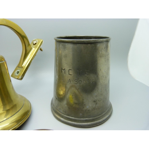 624 - A brass bell, magnifying glass and a pewter tankard