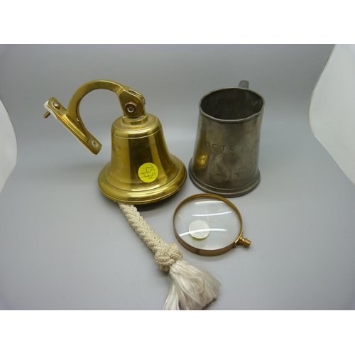 624 - A brass bell, magnifying glass and a pewter tankard