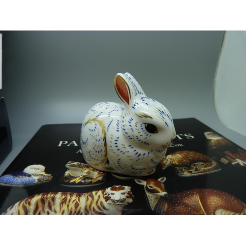 625 - A Royal Crown Derby 'bunny', boxed and a Royal Crown Derby Paperweights book