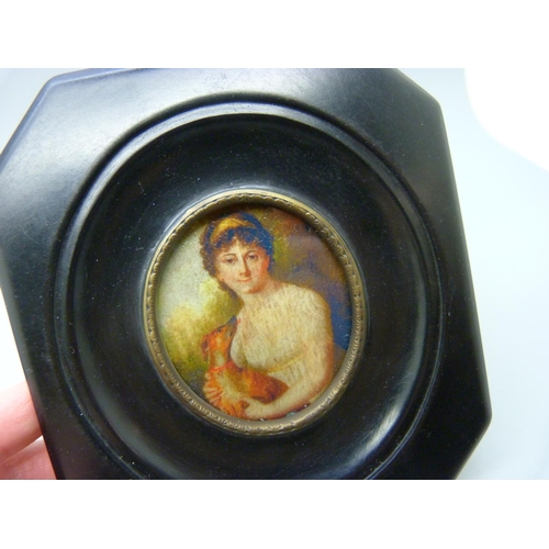 630 - A pair of miniatures in ebony style frames