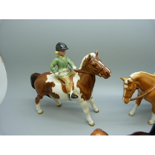 632 - A Beswick boy on pony and a Beswick girl on pony and a Ch. Wendover Billy