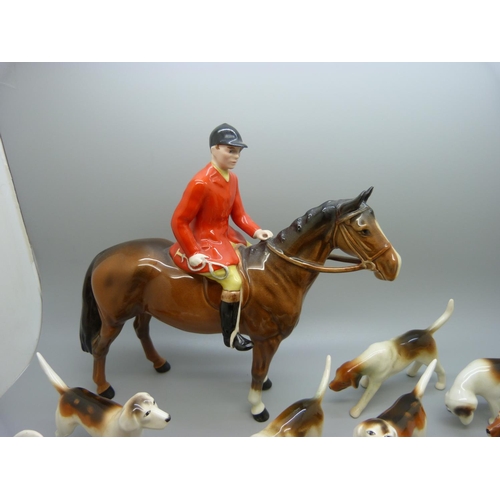 633 - A Beswick Huntsman, no. 1501, four Beswick hounds and five other hounds