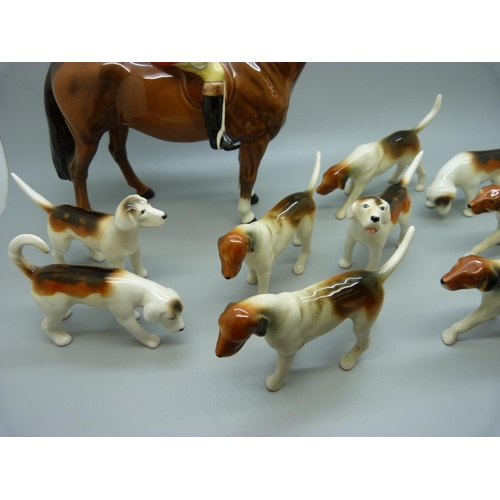 633 - A Beswick Huntsman, no. 1501, four Beswick hounds and five other hounds