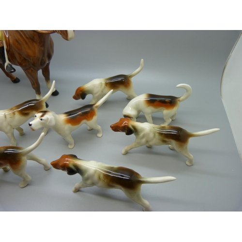 633 - A Beswick Huntsman, no. 1501, four Beswick hounds and five other hounds