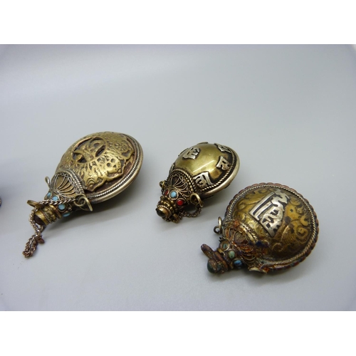 652 - Four Tibetan snuff bottles and a bell