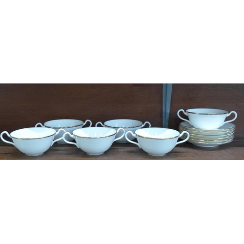 667 - A fine bone china set of six soup bowls and saucers