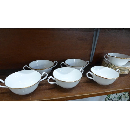 667 - A fine bone china set of six soup bowls and saucers