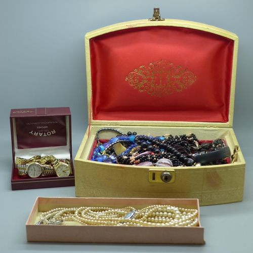 679 - Costume jewellery and wristwatches in a jewellery box