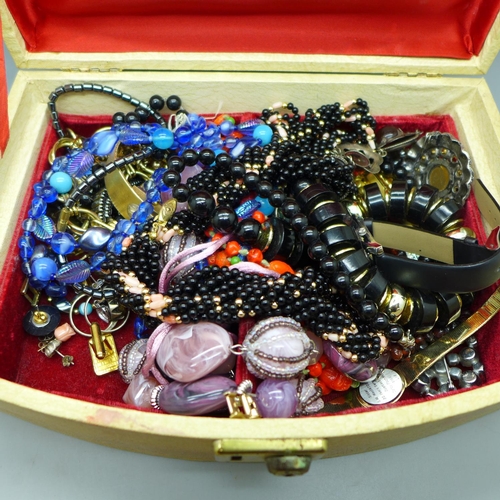 679 - Costume jewellery and wristwatches in a jewellery box