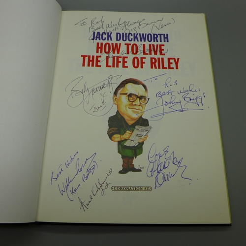 680 - A Coronation Street signed book including the actors who play Jack Duckworth, Mike Baldwin, Ken Barl... 