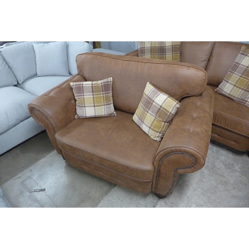 1549 - A County brown faux leather button back and studded three seater sofa and loveseat