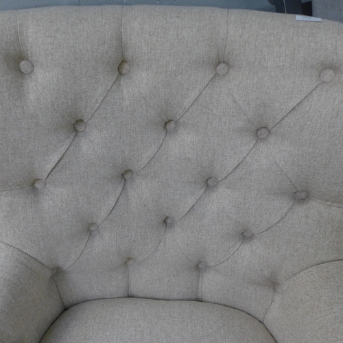 1458 - An Atlanta beige button back armchair