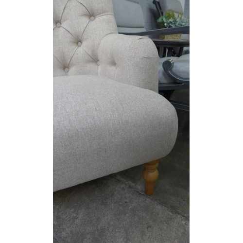 1458 - An Atlanta beige button back armchair