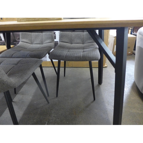 1520 - A Lutina table and four orbit grey chairs