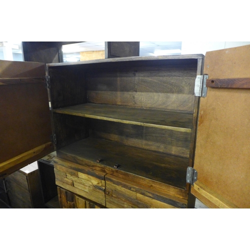 1574 - A railway sleeper four door, four drawer shelving unit