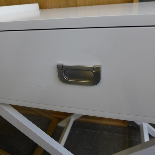 1593 - A white single drawer side table with cross legs