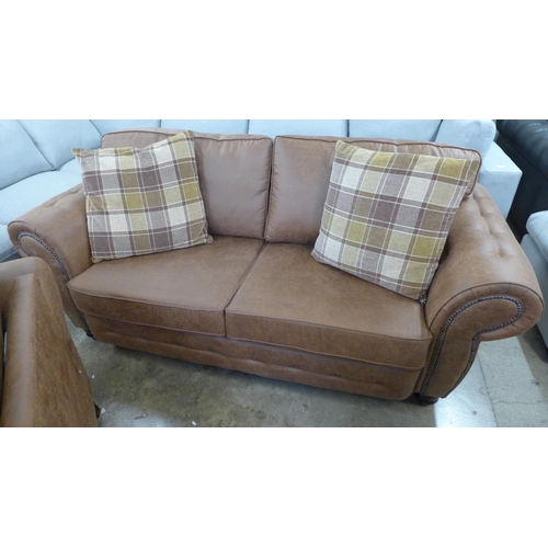 1549 - A County brown faux leather button back and studded three seater sofa and loveseat