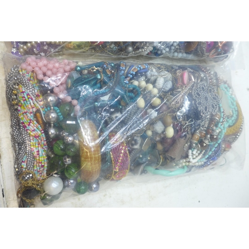 2243 - Two bags of approx 8kg mixed costume jewellery