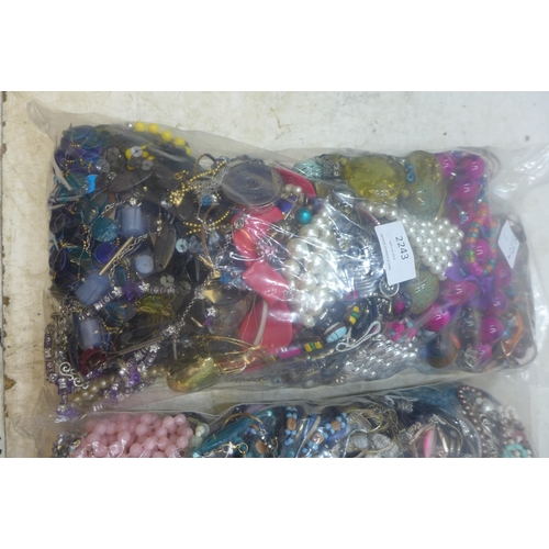 2243 - Two bags of approx 8kg mixed costume jewellery